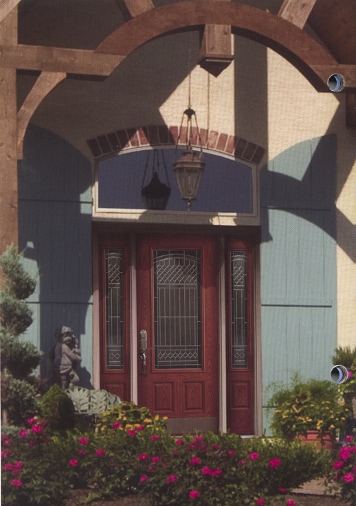 A red wooden door with decorative glass inside
