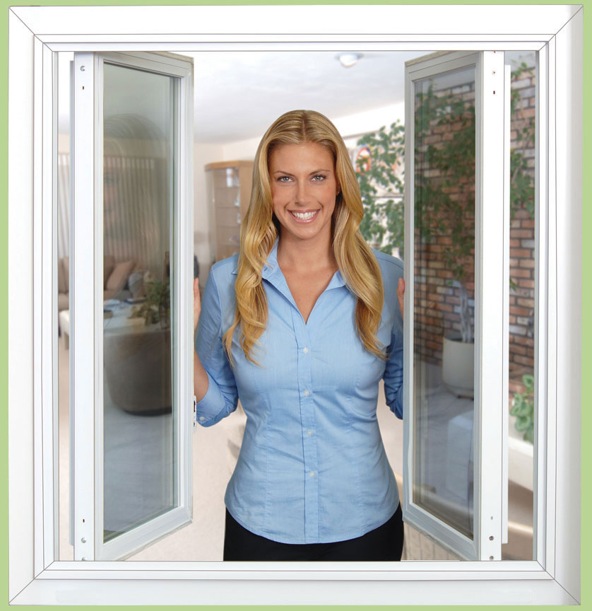 A woman standing in front of tilt-n-slide windows